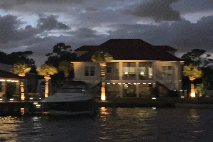 a large body of water with buildings in the background